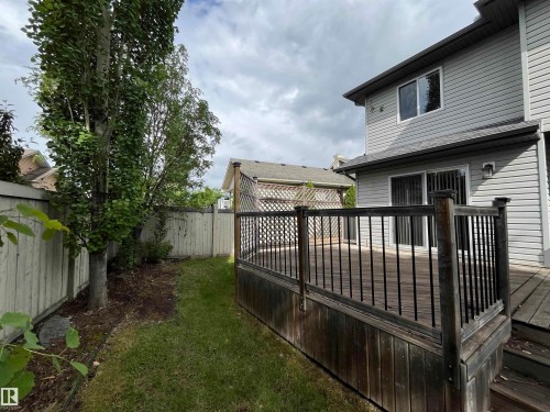 Expansive multi-level wood deck with black metal railings - 10 Erickson Close, St. Albert, AB 