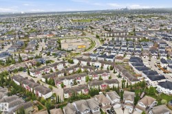 Expansive suburban landscape featuring a mix of single-family residences and multi-unit townhomes - 
