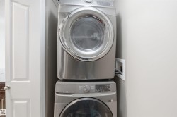 Vertical stacked washer and dryer unit - 