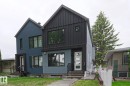 Modern facade featuring vertical panel siding, a peaked roofline, and an inviting entryway with a decorative glass door - 10628 81 Street Nw, Edmonton, AB 
