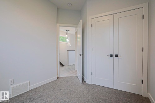 Double panel doors with matte black hardware - 10628 81 Street Nw, Edmonton, AB 