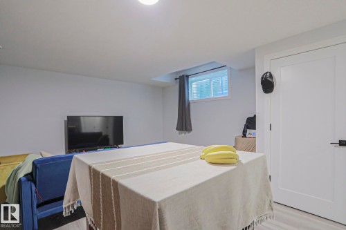Finished interior space with light-colored walls and wood-finish flooring - 10628 81 Street Nw, Edmonton, AB 