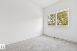 Large window, light gray carpeting, white walls, white trim - 