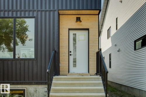 Vertical panel siding with expansive window - 11336 130 Street Nw, Edmonton, AB 