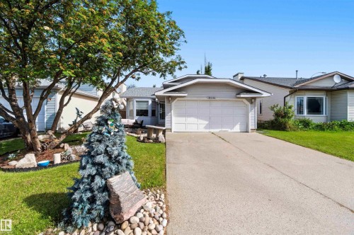 Single-story residence featuring a two-car garage and a paved driveway - 18808 72A Avenue, Edmonton, AB 
