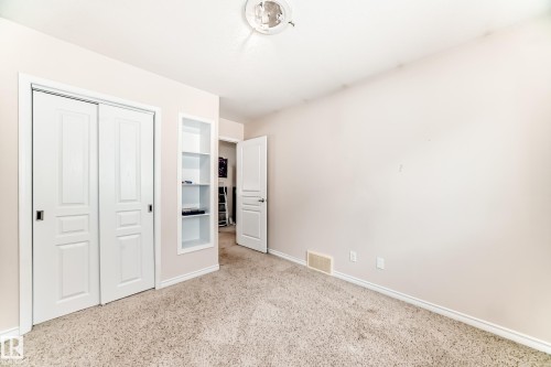 Neutral-toned wall paint and textured carpeting - 8730 180A Avenue, Edmonton, AB 
