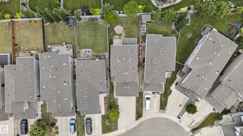 Aerial perspective of residential properties featuring shingled rooftops, private driveways, and landscaped backyards - 4612 Westcliff Point(E), Edmonton, AB 