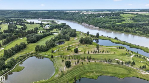 Expansive golf course terrain featuring manicured greens, multiple water features, mature trees, and a bordering river - 4612 Westcliff Point(E), Edmonton, AB 