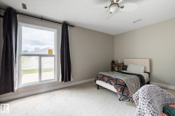 Neutral-toned wall paint and plush carpeting create a serene atmosphere - 
