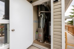 Utility closet housing essential systems, including a Bryant furnace and water heater - 