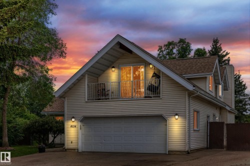 Contemporary residence featuring light-toned siding and a prominent two-car garage - 8224 186 Street Nw, Edmonton, AB 