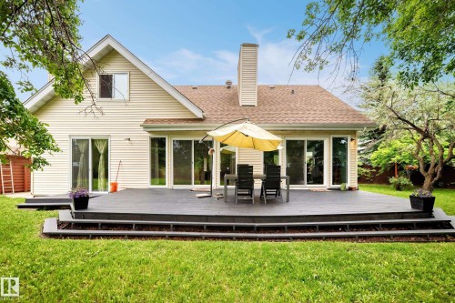 Spacious multi-level composite deck with wide steps and sliding glass doors - 8224 186 Street Nw, Edmonton, AB 