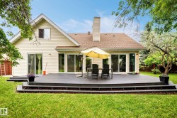 Spacious multi-level composite deck with wide steps and sliding glass doors - 