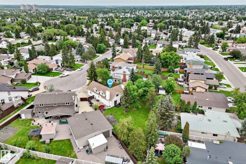 Residential property with a light-toned exterior and a dark roof, situated on a cul-de-sac - 8224 186 Street Nw, Edmonton, AB 