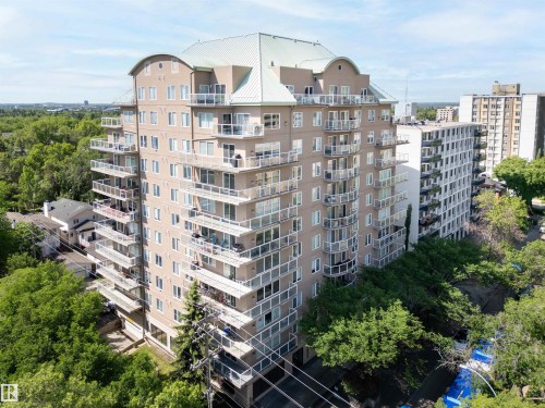 Multi-story residential building featuring numerous private balconies with glass railings - 305 11111 82 Avenue, Edmonton, AB 