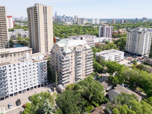 High-rise building with a distinctive curved facade and multiple private balconies - 305 11111 82 Avenue, Edmonton, AB 