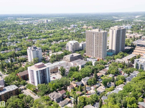 Aerial perspective showcasing a diverse urban landscape with residential and high-rise buildings - 305 11111 82 Avenue, Edmonton, AB 