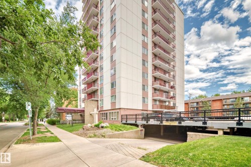 Multi-story residential building with private balconies and an integrated covered parking entrance - 401 11007 83 Avenue, Edmonton, AB 