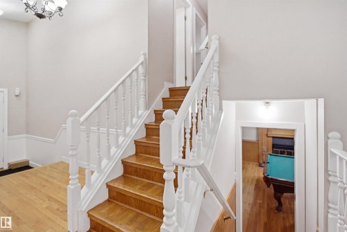 Hardwood staircase with white balusters and handrails - 3220 42A Avenue, Edmonton, AB 