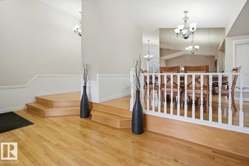 Hardwood flooring featured throughout the entry and dining area - 3220 42A Avenue, Edmonton, AB 