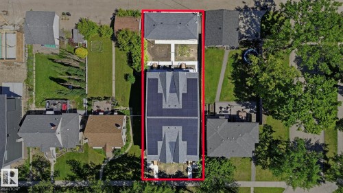 Aerial perspective showcasing a multi-unit property with a long, rectangular lot - 11007 132 Street, Edmonton, AB 