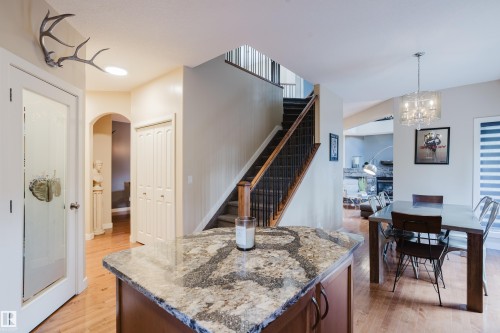 Kitchen island featuring a granite countertop - 5206 Cercle Ciel Crescent, Beaumont, AB 