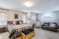 Spacious room featuring neutral carpeting and a light beige wall color - 