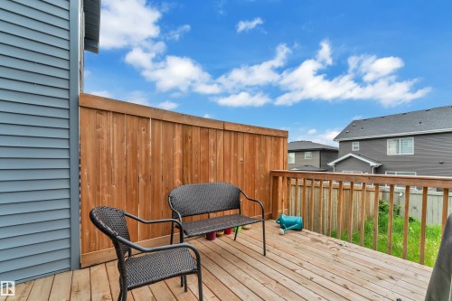 Expansive wood-plank deck with a wood privacy screen - 9328 Pear Link Link, Edmonton, AB 