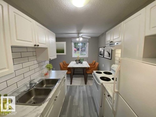 Kitchen - 107 Village Acres Northwest, Edmonton, AB - Indoor Photo Showing Kitchen With Double Sink