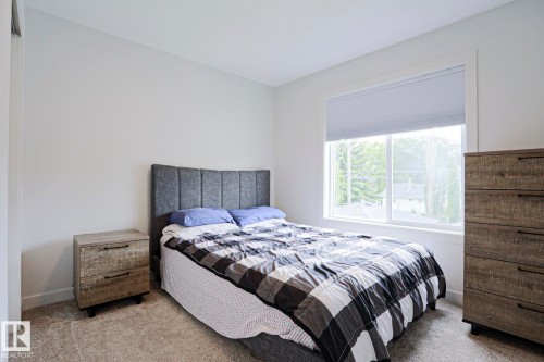 Bedroom featuring light gray carpeting and white walls - 12842 121 Street, Edmonton, AB 