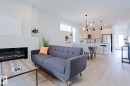 Open-concept living area with light wood-finish flooring - 12842 121 Street, Edmonton, AB 