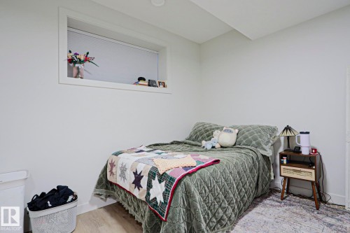 Bedroom featuring neutral walls, recessed lighting, and wood-finish flooring - 12842 121 Street, Edmonton, AB 