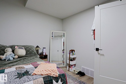 Neutral-toned walls complement wood-finish flooring - 12842 121 Street, Edmonton, AB 