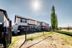 Rear exterior featuring a two-story design with light-colored siding - 