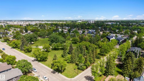 Expansive green space featuring mature trees and open lawn areas - 12611 47 Street, Edmonton, AB 