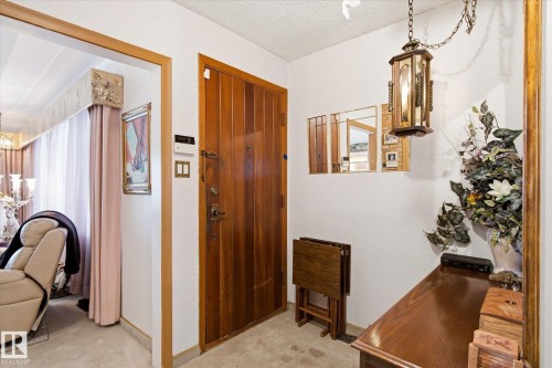 Solid wood entry door with ornate hardware - 9747 67 Avenue, Edmonton, AB 