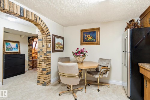 Kitchenette with light-toned flooring and a light-colored wall finish - 9747 67 Avenue, Edmonton, AB 