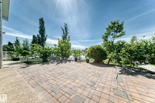 Expansive outdoor patio featuring paver stones with a varied pattern - 352 Ozerna Road, Edmonton, AB 