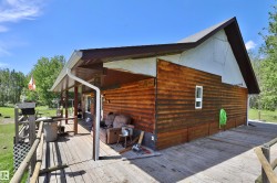 Wood-sided exterior featuring an extensive wrap-around deck - 
