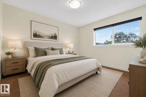 Recessed lighting illuminates this room featuring a large window with gridded panes, wood-finish baseboards, and neutral wall tones - 5244 1A Avenue, Edmonton, AB 