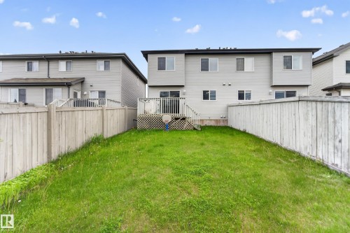 Expansive fenced backyard with a green lawn - 5244 1A Avenue, Edmonton, AB 