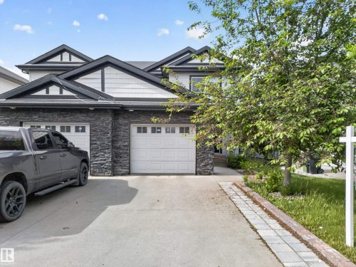 Contemporary exterior with stone veneer and horizontal siding accents - 5244 1A Avenue, Edmonton, AB 