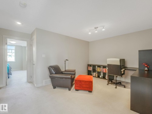 Light-colored carpeting throughout, recessed ceiling lighting, track lighting fixture, white baseboards, and neutral wall paint - 3 1641 James Mowatt Trail, Edmonton, AB 