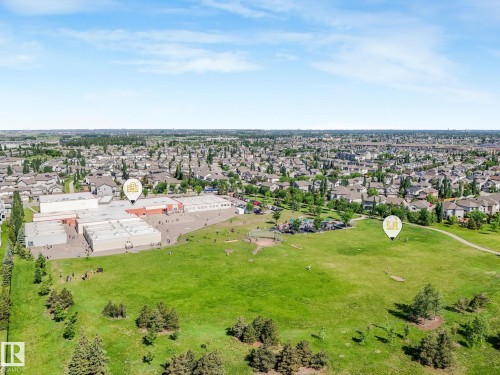 Aerial perspective showcasing a sprawling residential community - 3 1641 James Mowatt Trail, Edmonton, AB 