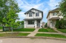 Two-story residence featuring white siding and dark trim accents - 21384 88 Avenue, Edmonton, AB 