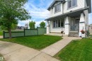 Two-story residence featuring white siding and dark trim accents - 21384 88 Avenue, Edmonton, AB 