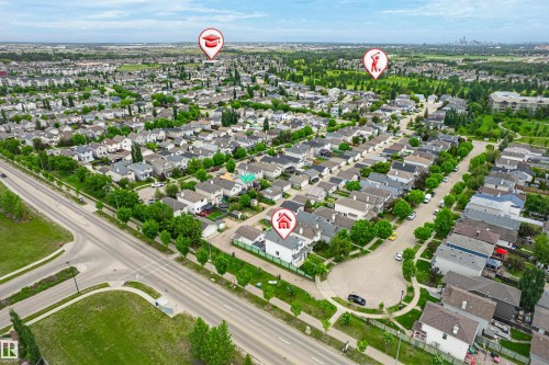 Aerial perspective of a residential neighborhood featuring numerous detached homes with varied rooflines and a network of paved roads - 21384 88 Avenue, Edmonton, AB 