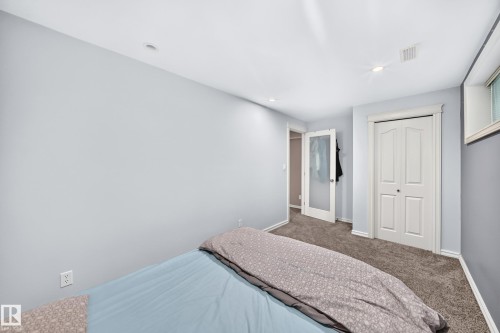 Carpeted room with recessed lighting and a window - 3224 26 Street, Edmonton, AB 