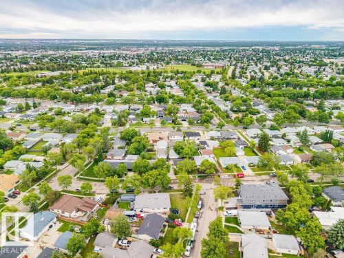 Expansive aerial capturing a vast residential community with numerous detached homes - 6204 150 Avenue, Edmonton, AB 