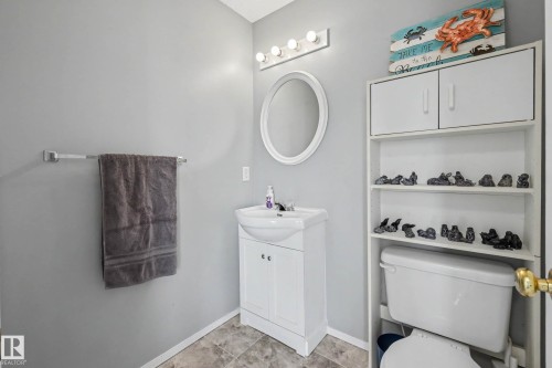 2 piece bathroom by the back door - 2123 36 Avenue, Edmonton, AB - Indoor Photo Showing Bathroom